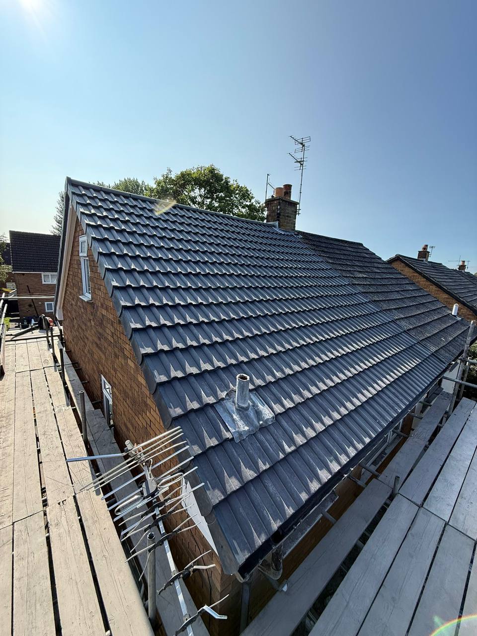 Re-roof with dark grey tiles